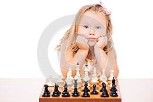 Little girl playing chess