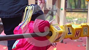 Little girl playing with cubes on the playground