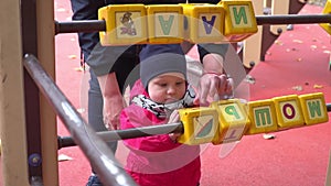 Little girl playing with cubes on the playground