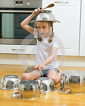 Little girl playing drums.