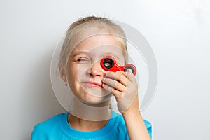 Little girl playing with fidget spinner