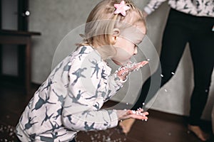 Little girl is playing with foam balls