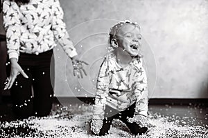 Little girl is playing with foam balls