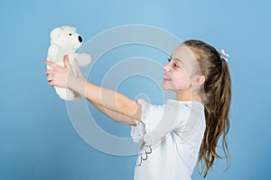 Little girl playing game in playroom. small girl with soft bear toy. child psychology playground in kindergarten. toy