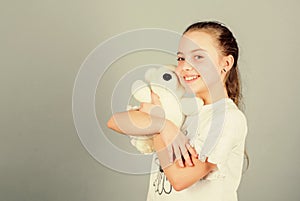 Little girl playing game in playroom. toy shop. childrens day. Best friend. small girl with soft bear toy. child