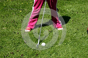 Little girl playing golf