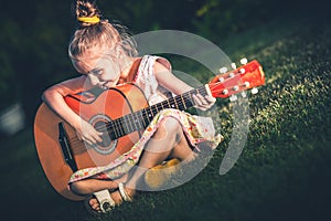 Little Girl Playing Guitar