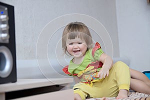 Little girl playing at home happy smiling