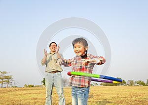 little girl playing with hula hoops outdoors