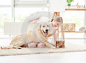 Little girl playing music with dog