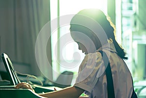 Little girl playing with piano and Music Tablet at home