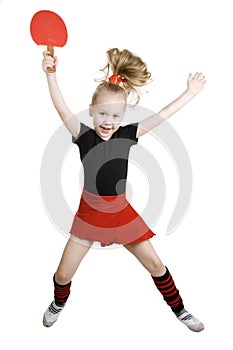 Little girl playing ping-pong.