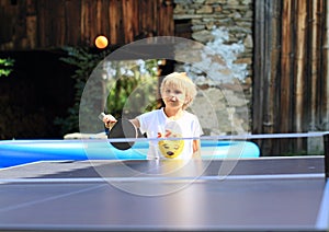 Little girl playing ping-pong