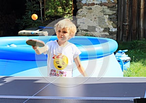 Little girl playing ping-pong