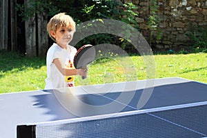 Little girl playing ping-pong