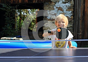 Little girl playing ping-pong