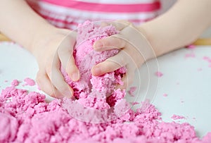 Little Girl Playing with Pink Kinetic Sand at Home Early Education Preparing for School Development Children Game