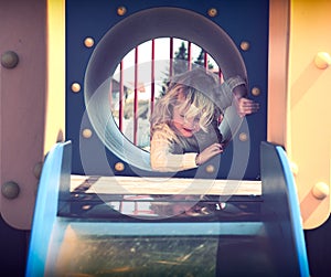 Little girl playing in the playground