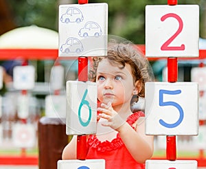 Little girl playing on the playground