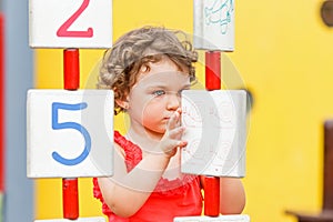 Little girl playing on the playground