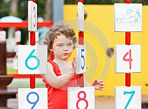 Little girl playing on the playground