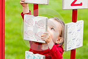 Little girl playing on the playground