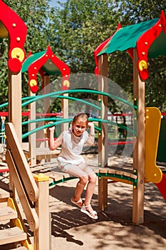 Little girl is playing at playground