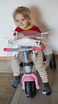 Little girl playing with quadrocopter