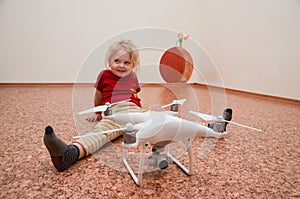 Little girl playing with quadrocopter