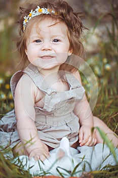 Little girl playing with rabbit in the village. Outdoor. Summer portrait.