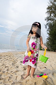 Little girl playing sand