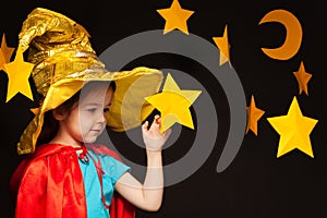 Little girl playing sky watcher with handmade star