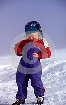 Little Girl Playing In Snow