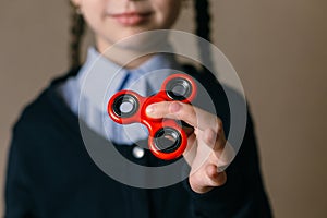 Little girl playing with a spinner