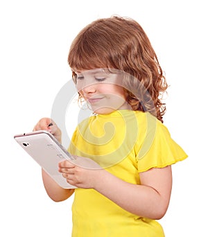 Little girl playing with tablet