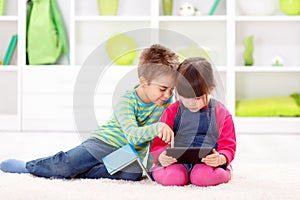 Little girl playing on a tablet computer