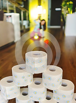 Little girl playing toilet roll bowling