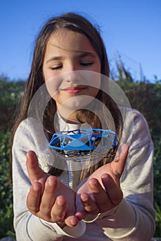 Little girl playing with toy dron photo