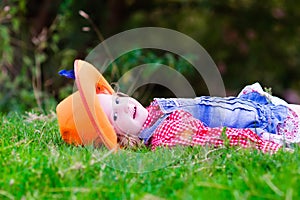 Little girl playing with toy horse in cowboy costume