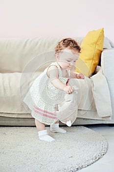 Little girl playing with toy rabbit