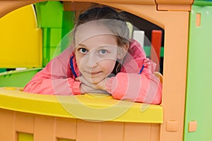 Little girl is playing with toys in the children`s room