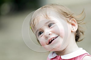 Little girl playing in a urban park