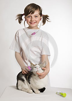 Little girl playing at the vet photo