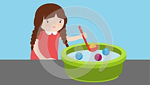 little girl playing with water and bubbles in a bowl
