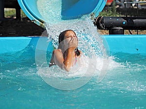 Little girl playing in a water park