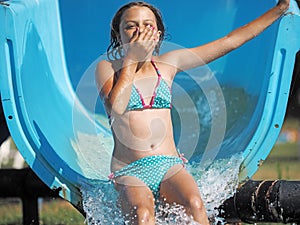 Little girl playing in a water park