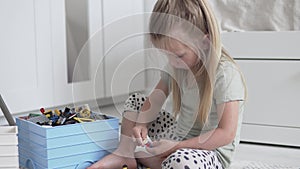 A little girl plays in the designer of the house.