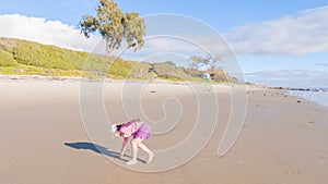 Little Girl Plays on Empty California Beach