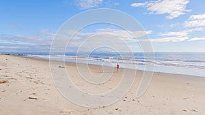 Little Girl Plays on Empty California Beach