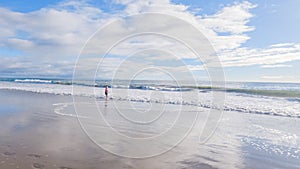 Little Girl Plays on Empty California Beach